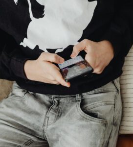 Teenager is looking at his phone